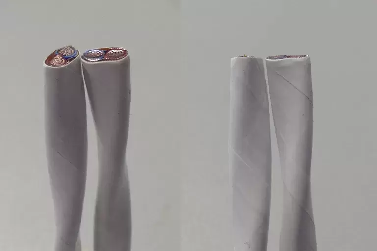 Gray and light gray wrapper for two wire of multi color inside it.